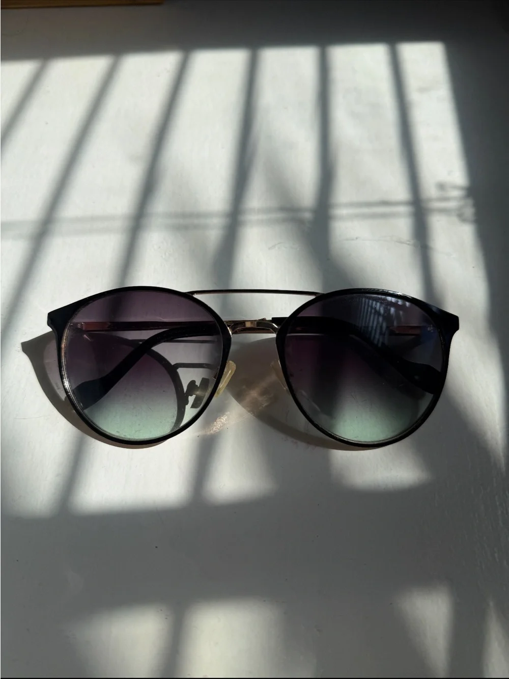 Gold and black sunglasses - a little scratched but not noticeable when worn